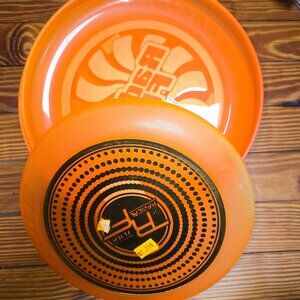8 orange Frisbees